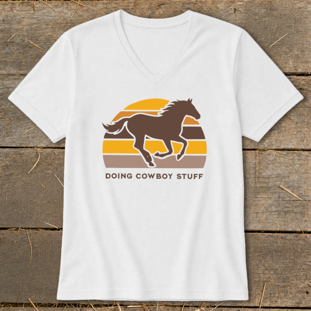 White t-shirt with a brown running horse silhouette over a striped sunset graphic and text.