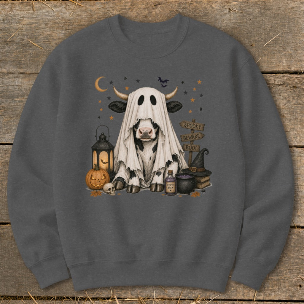 Cow in a ghost costume surrounded by Halloween decor and spooky signs.