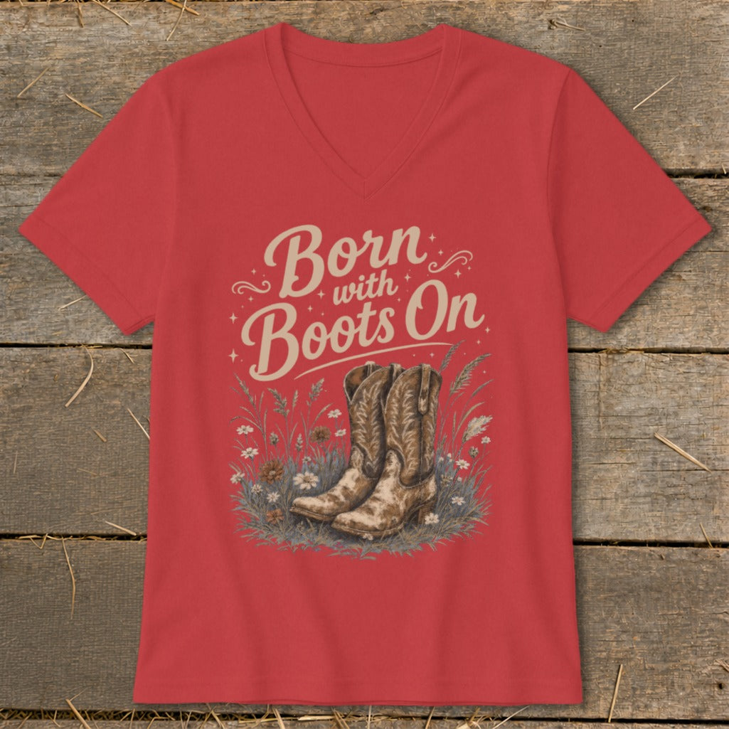 Red v-neck t-shirt with "Born with Boots On" text and cowboy boots graphic.