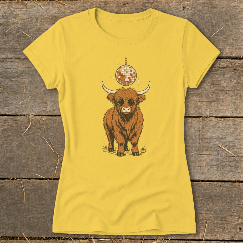 Yellow t-shirt with a graphic of a highland cow wearing sunglasses and a disco ball.