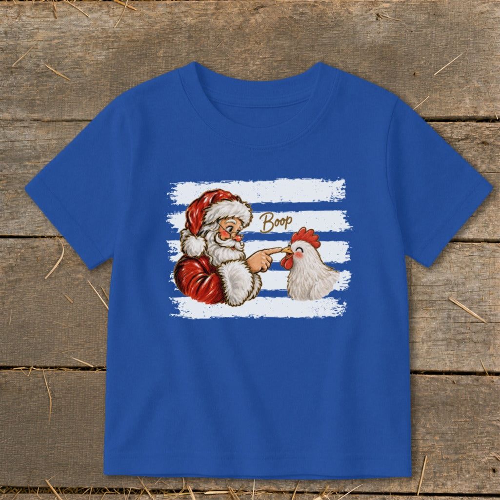 Santa booping a chicken with the word "Boop" above them on a blue t-shirt.
