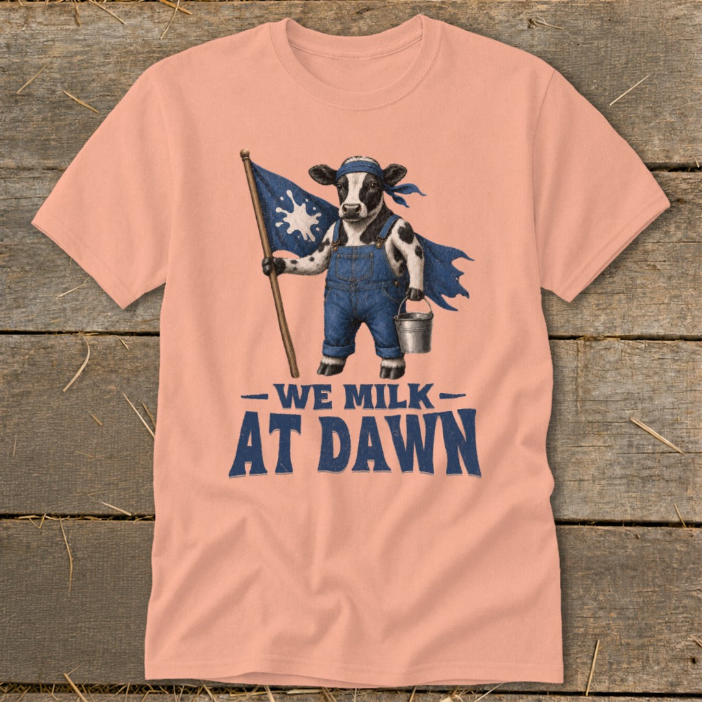 Cow with bandana, cape, overalls, holding flag and bucket, text "WE MILK AT DAWN".