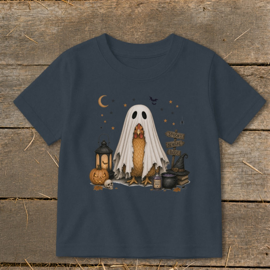 Chicken wearing ghost costume with Halloween decorations and spooky sign.