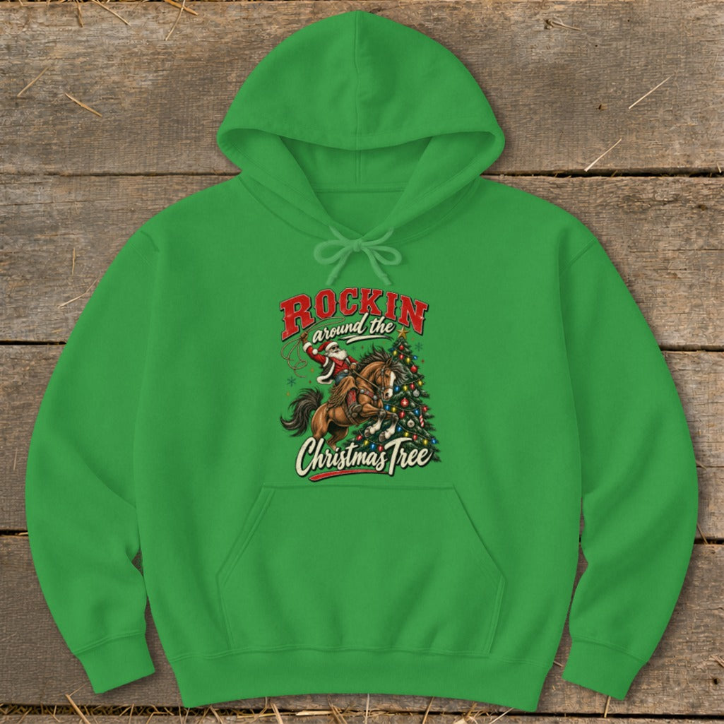 Green hoodie with illustration of Santa riding a horse around a Christmas tree. Text says "Rockin Around the Christmas Tree".