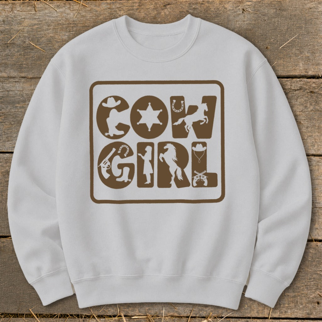 White sweatshirt with "COW GIRL" text and western-themed graphics.