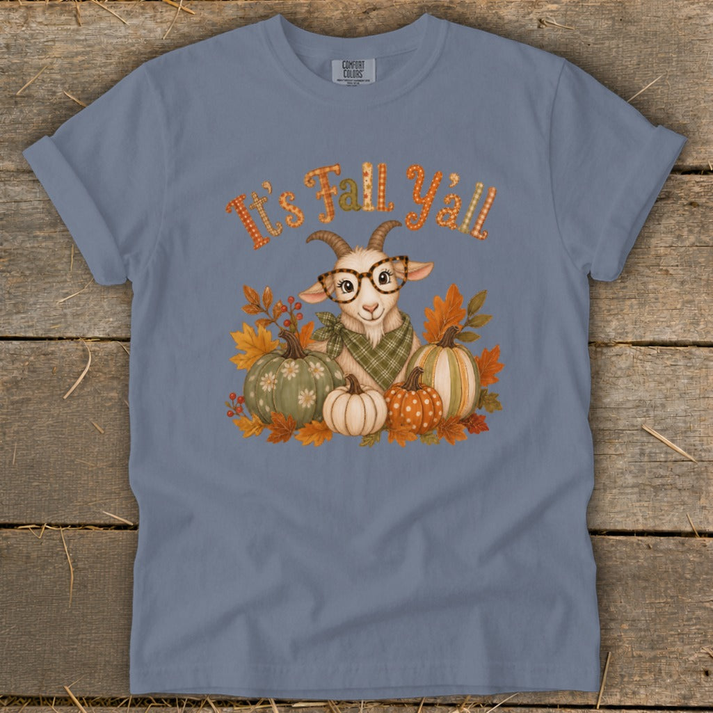 T-shirt graphic featuring a goat with glasses surrounded by pumpkins and fall leaves, with text "It's Fall Y'all."
