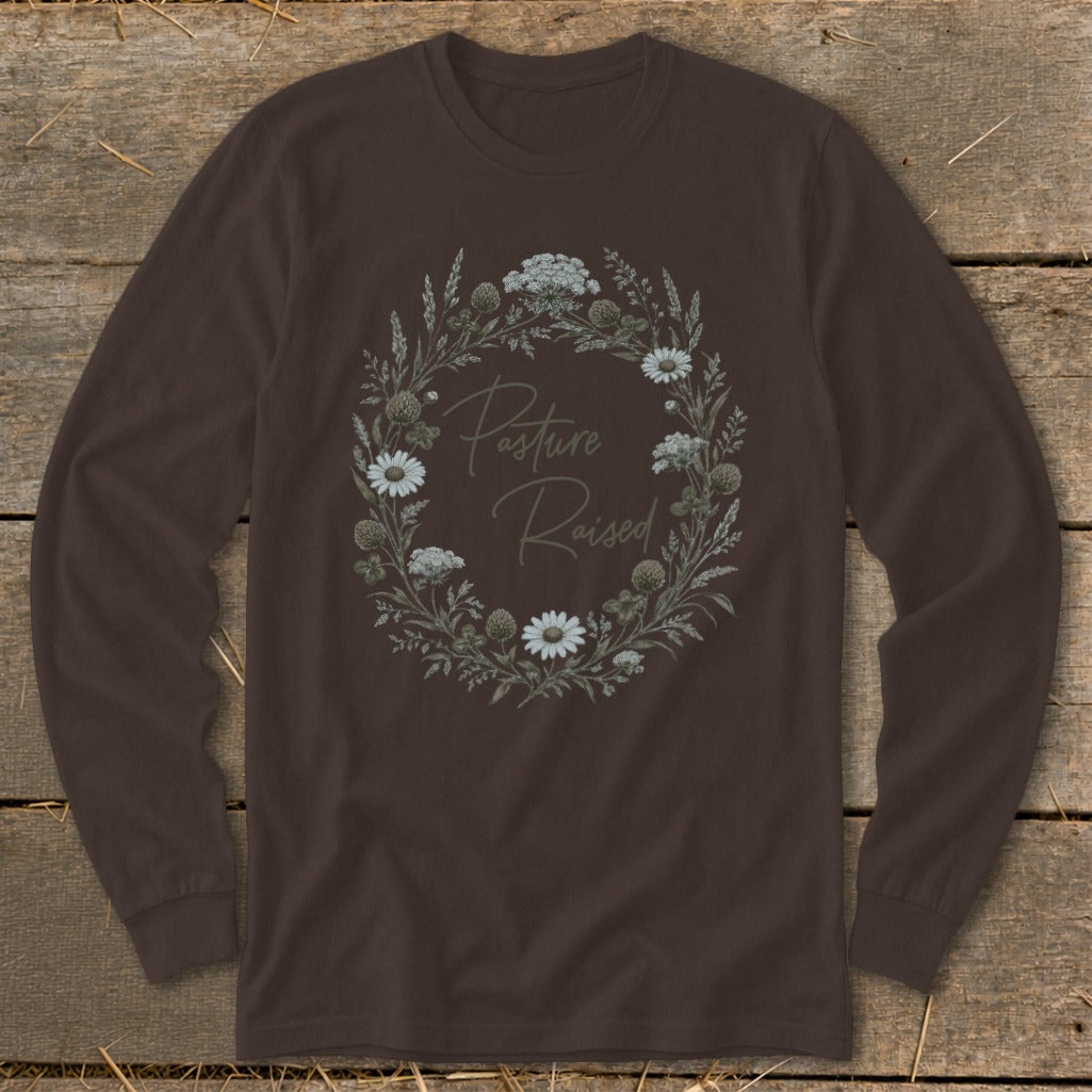 Brown long sleeve shirt with floral wreath graphic that reads "Pasture Raised".