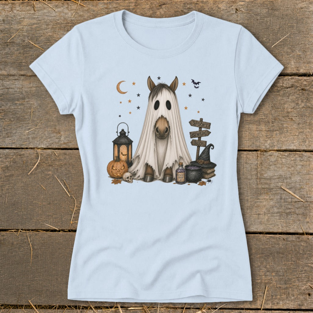 Horse dressed as a ghost with Halloween decorations including pumpkin, lantern, and signs.