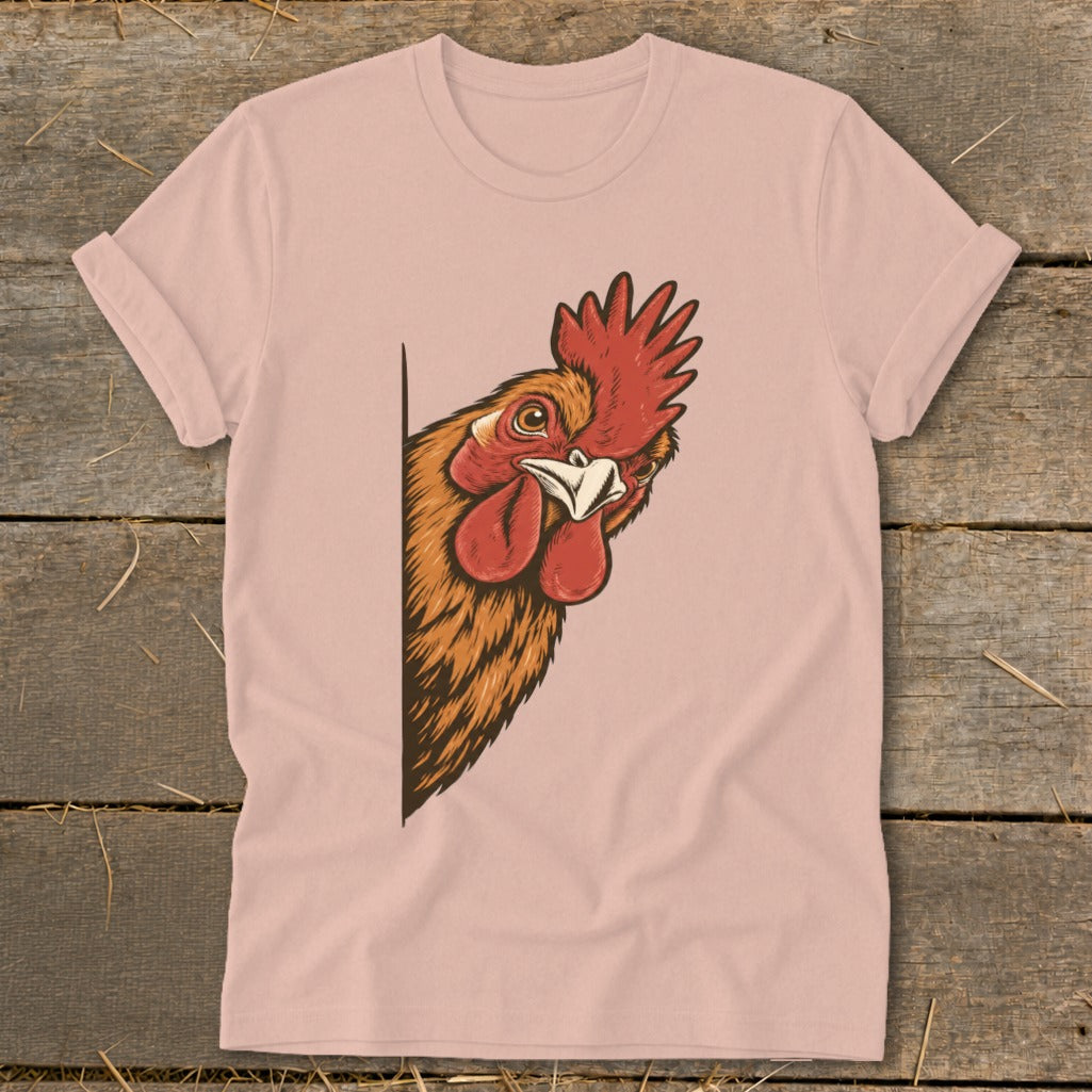 Rooster peeking from the side of a pink t-shirt.