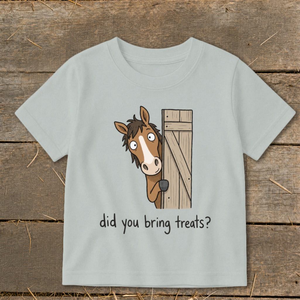 Light blue t-shirt with cartoon horse peeking around a wooden gate asking "did you bring treats?".