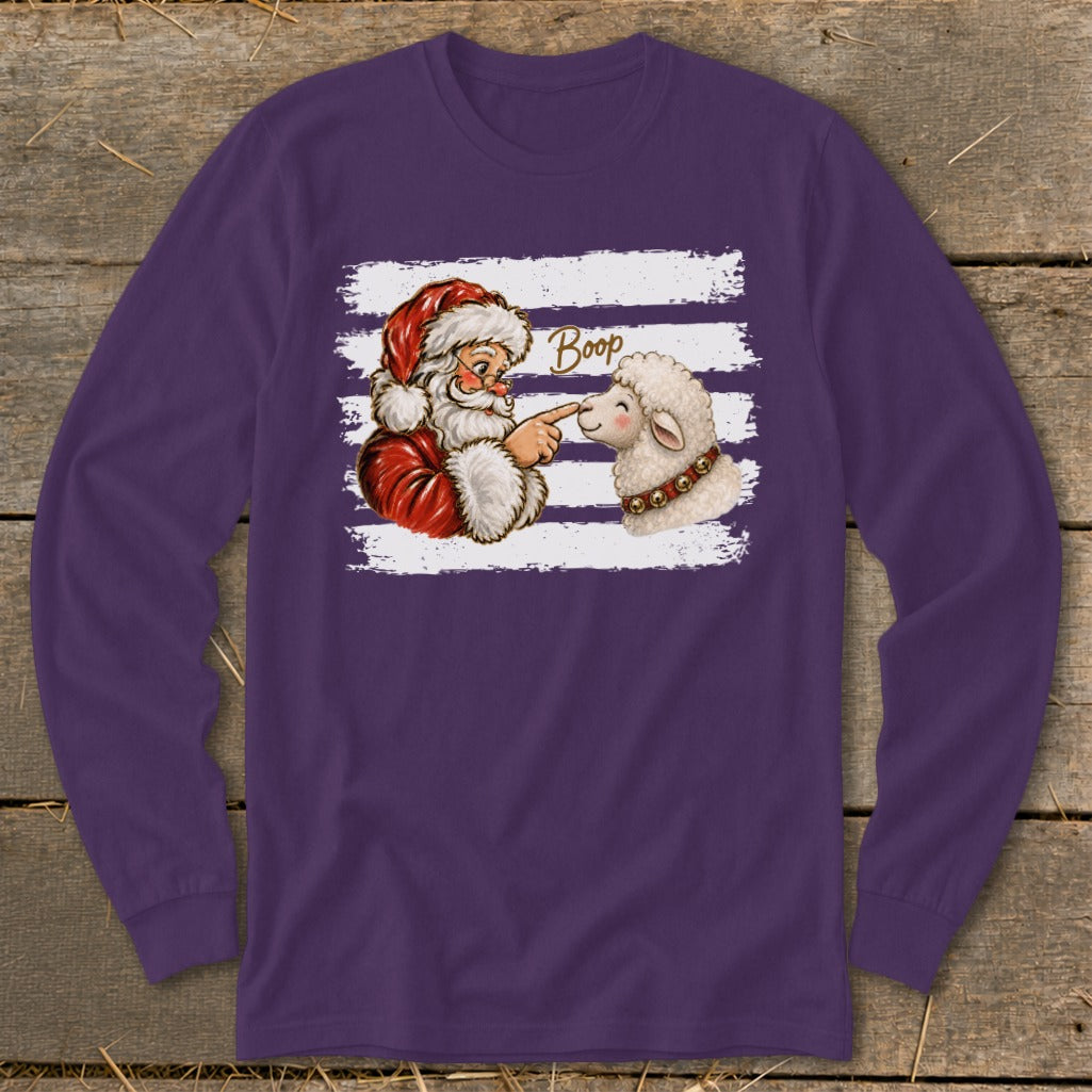 Santa touching a sheep's nose with the word "Boop" above.