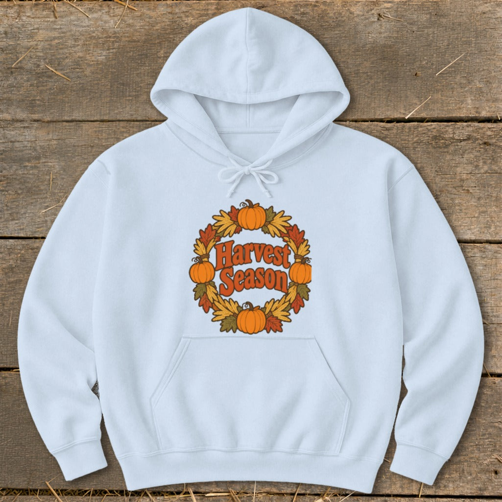 Light blue hoodie with a "Harvest Season" graphic featuring pumpkins and autumn leaves.