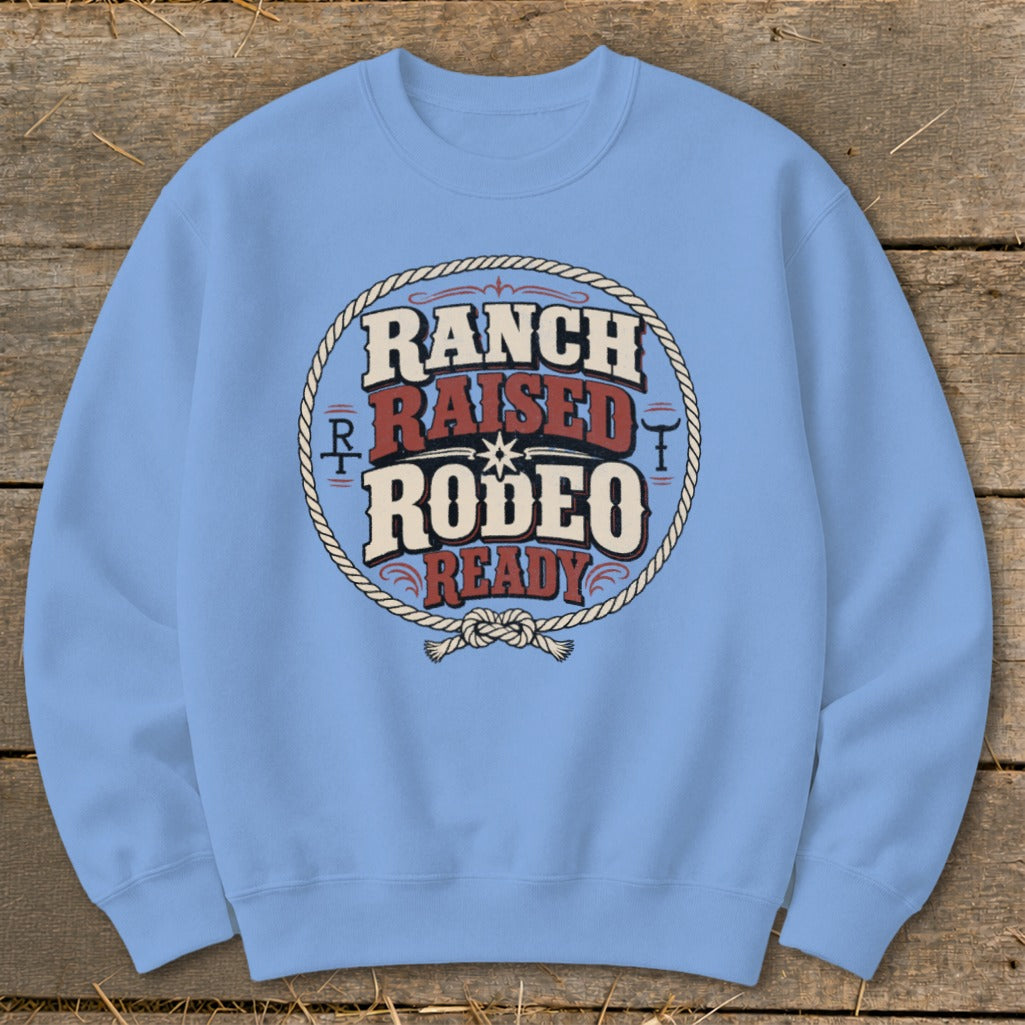 Light blue sweatshirt with "Ranch Raised Rodeo Ready" text inside a rope circle.