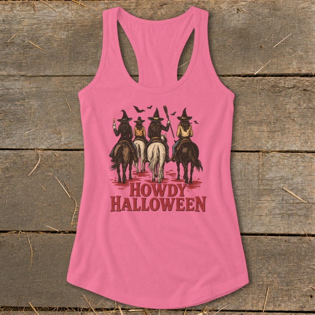 Pink tank top with "Howdy Halloween" and four witches riding horses graphic.