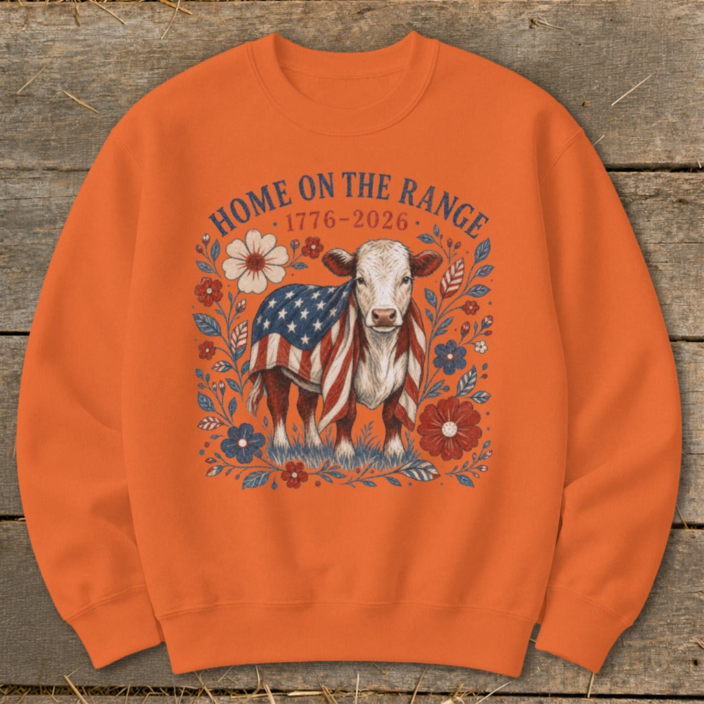Cow draped in American flag with "Home on the Range 1776-2026" text.