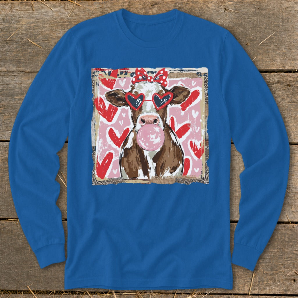 Cow wearing heart sunglasses and red polka dot bow, blowing bubblegum, on pink heart background.