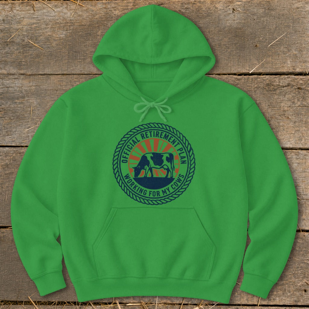 Green hoodie with "Official Retirement Plan Working For My Cows" text and cow graphic.