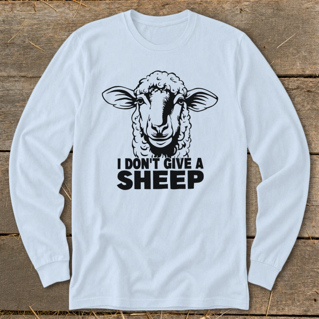 Long sleeve white shirt with black graphic of sheep and text "I DON'T GIVE A SHEEP".