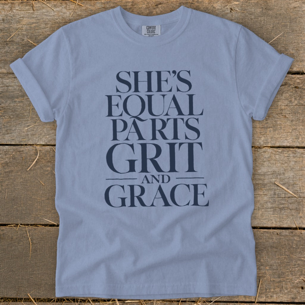 Light blue Comfort Colors t-shirt with "SHE'S EQUAL PARTS GRIT AND GRACE" text.
