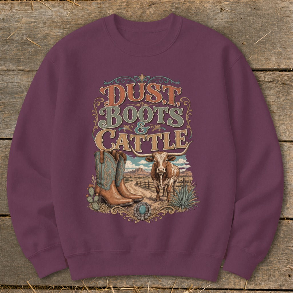 Crewneck sweatshirt with "Dust, Boots & Cattle" graphic featuring boots, longhorn, and desert landscape.