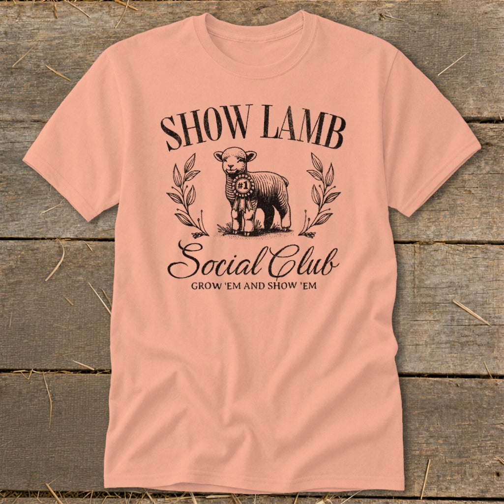 Peach t-shirt with a graphic of a lamb, the words "SHOW LAMB Social Club", and "GROW 'EM AND SHOW 'EM".
