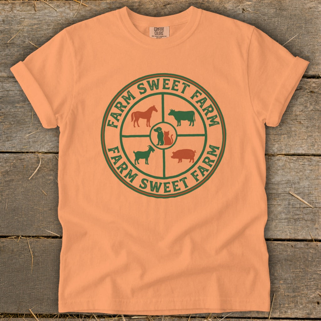 Orange t-shirt with "FARM SWEET FARM" text and farm animals in a circular design.