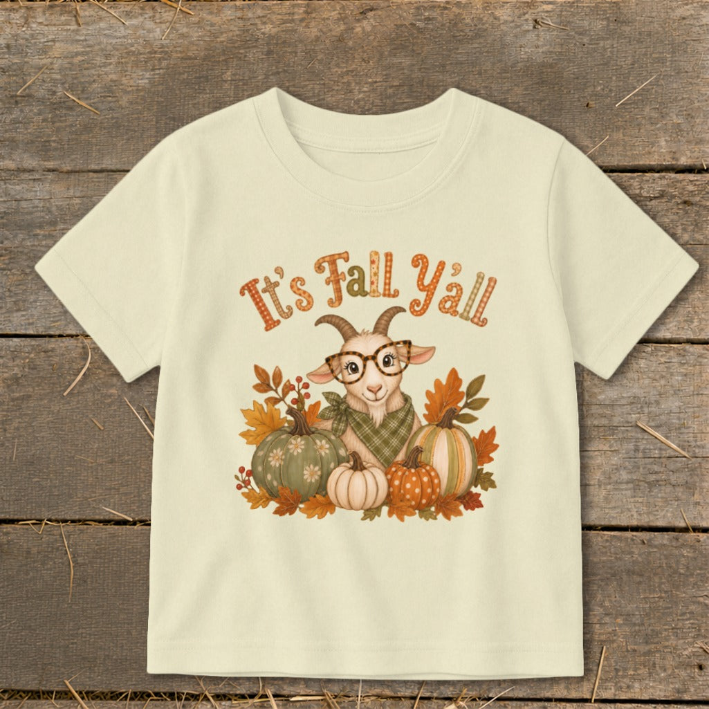 Cream t-shirt with a cartoon goat, pumpkins, and autumn leaves, reads "It's Fall Yall."