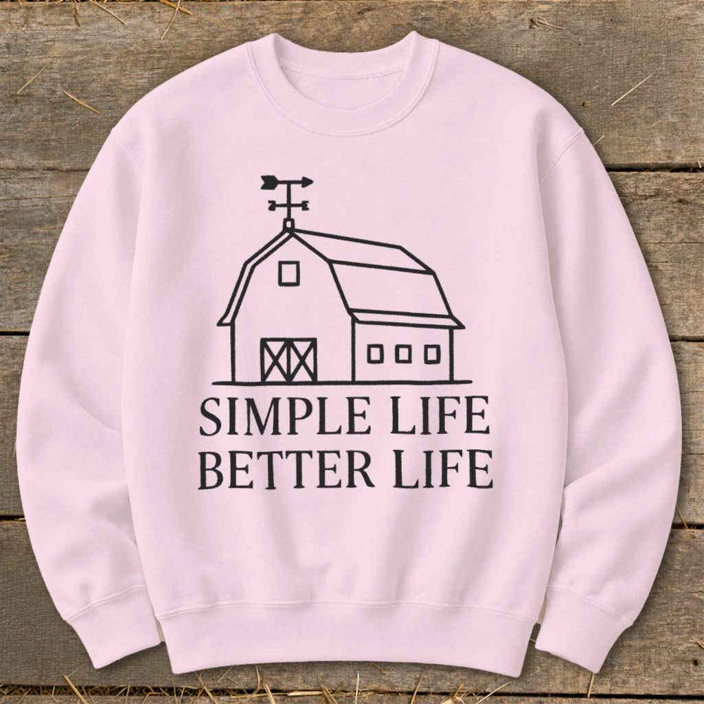Pink sweatshirt with a barn graphic and text "SIMPLE LIFE BETTER LIFE".
