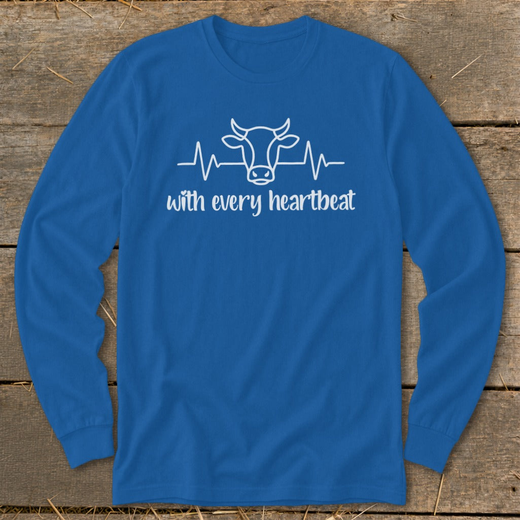 Blue long sleeve shirt with white cow and heartbeat graphic and text.