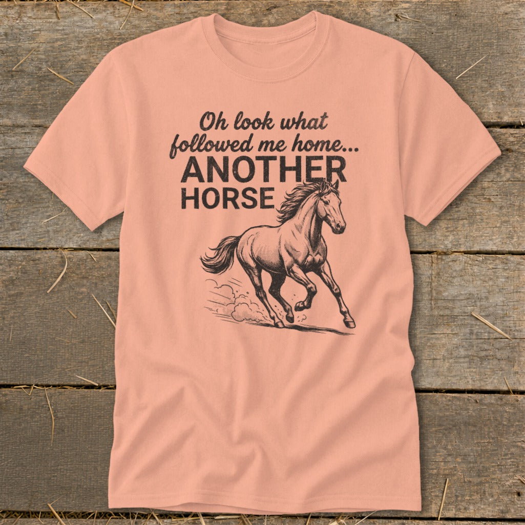 Peach t-shirt with text "Oh look what followed me home... ANOTHER HORSE" and a horse graphic.