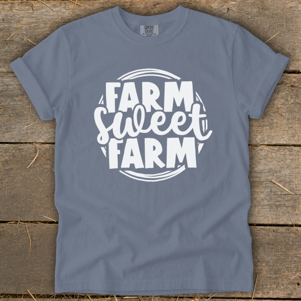 Blue t-shirt with white text that reads "FARM Sweet FARM" within a circular design.