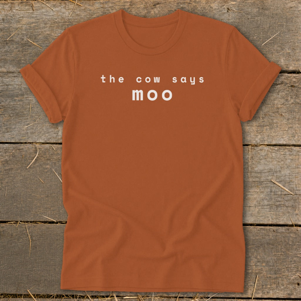 Orange t-shirt with white text "the cow says moo"
