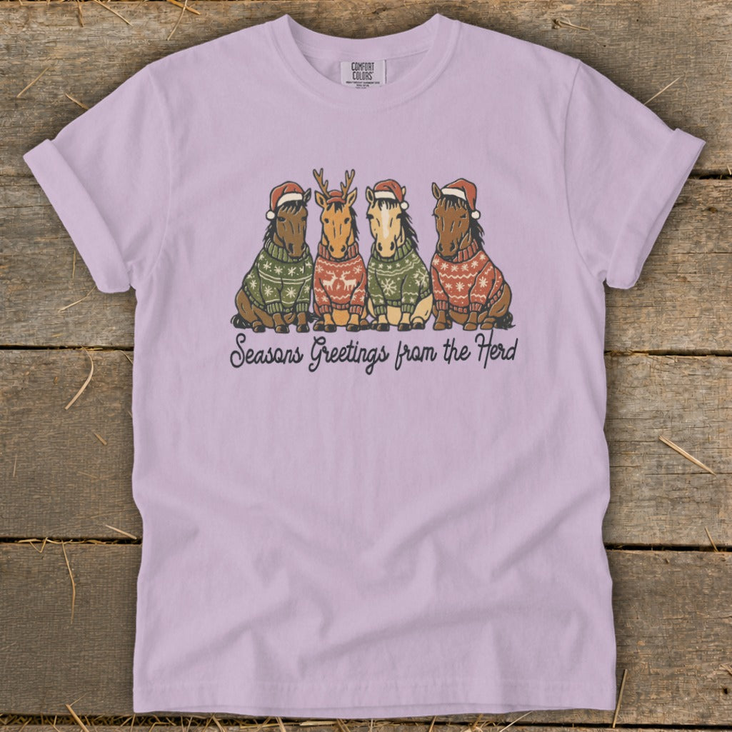 Four horses wearing Santa hats and festive sweaters, with "Seasons Greetings from the Herd" text.