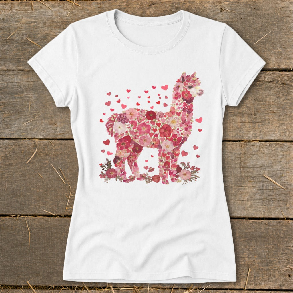 White t-shirt with an alpaca design made of pink and red flowers and hearts.