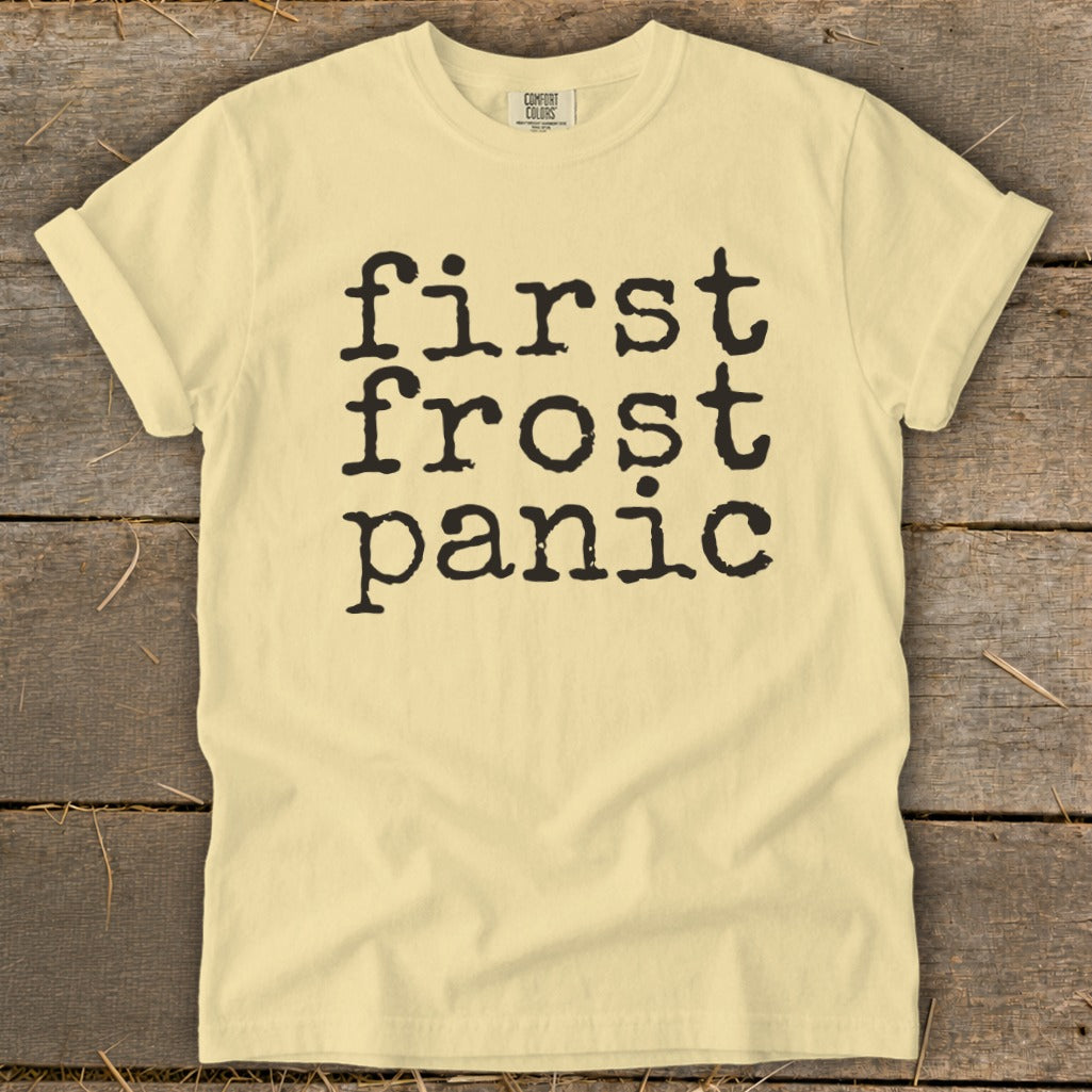 Light yellow t-shirt with black text "first frost panic".