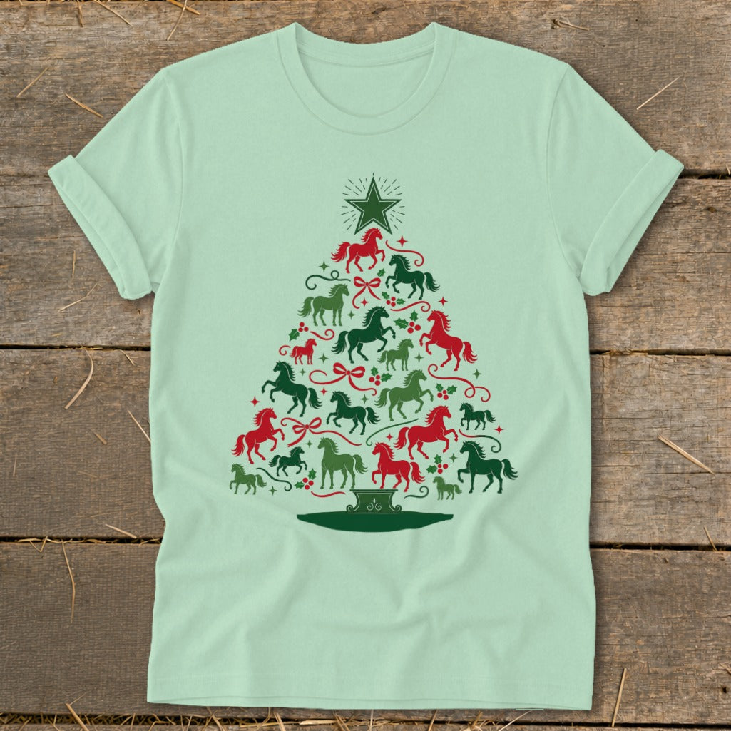 Light green t-shirt with Christmas tree made of red and green horses and festive accents.