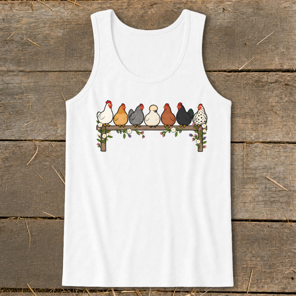White tank top featuring an illustration of seven colorful chickens sitting on a flower-adorned wooden fence.