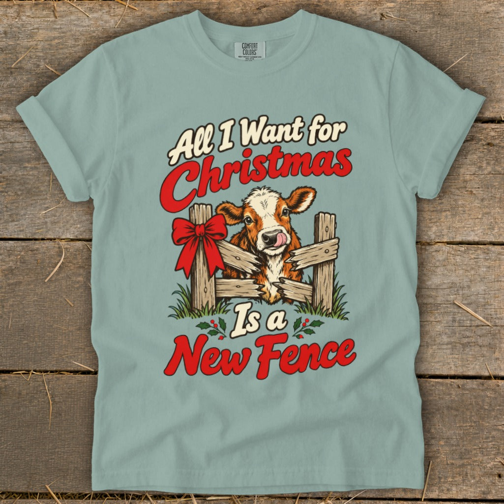 T-shirt with cow and fence graphic, "All I Want for Christmas Is a New Fence" text.