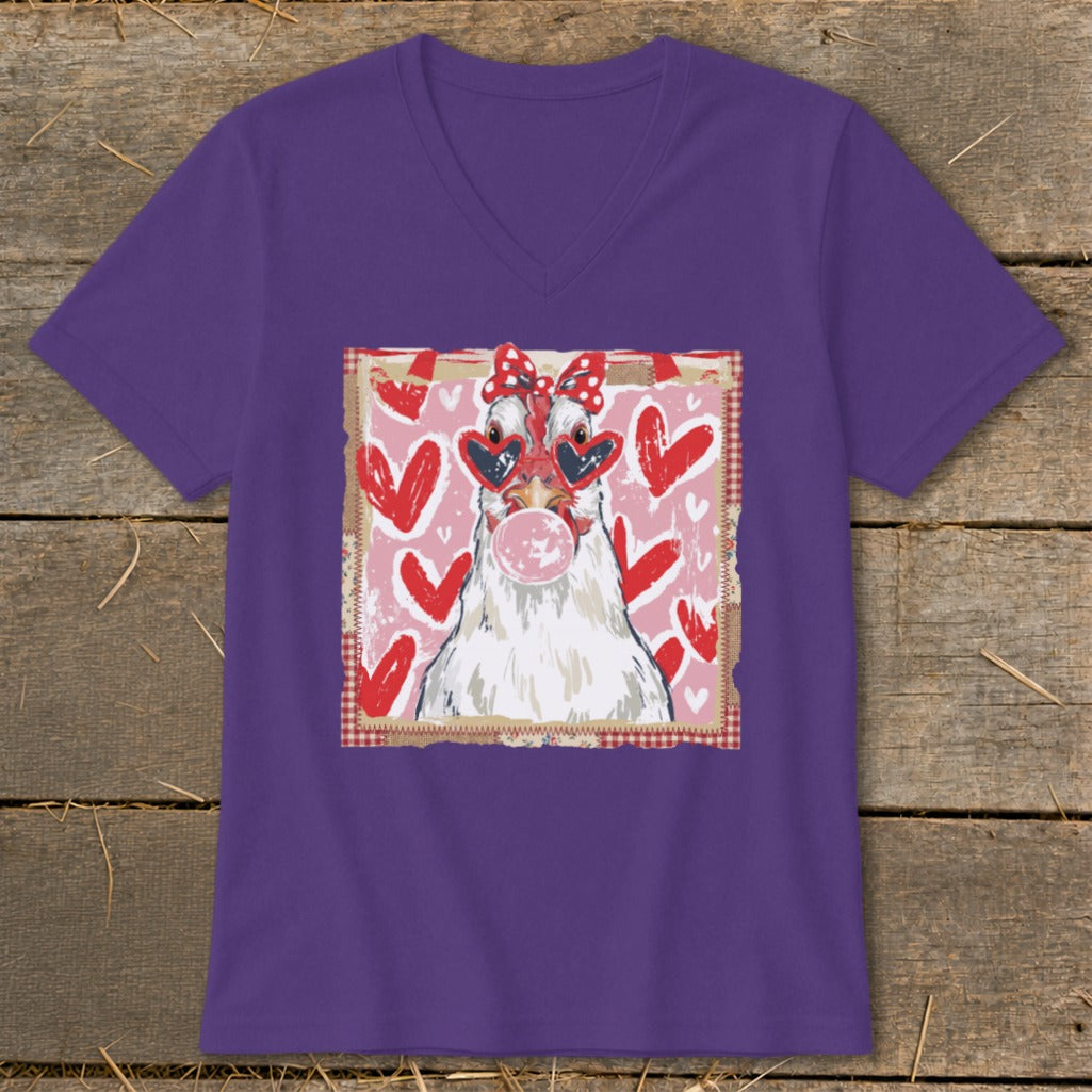 Purple t-shirt with a white chicken wearing heart sunglasses and a bow, blowing bubblegum.