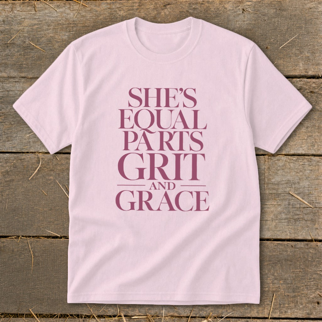 Pink t-shirt with purple text "She's Equal Parts Grit and Grace".