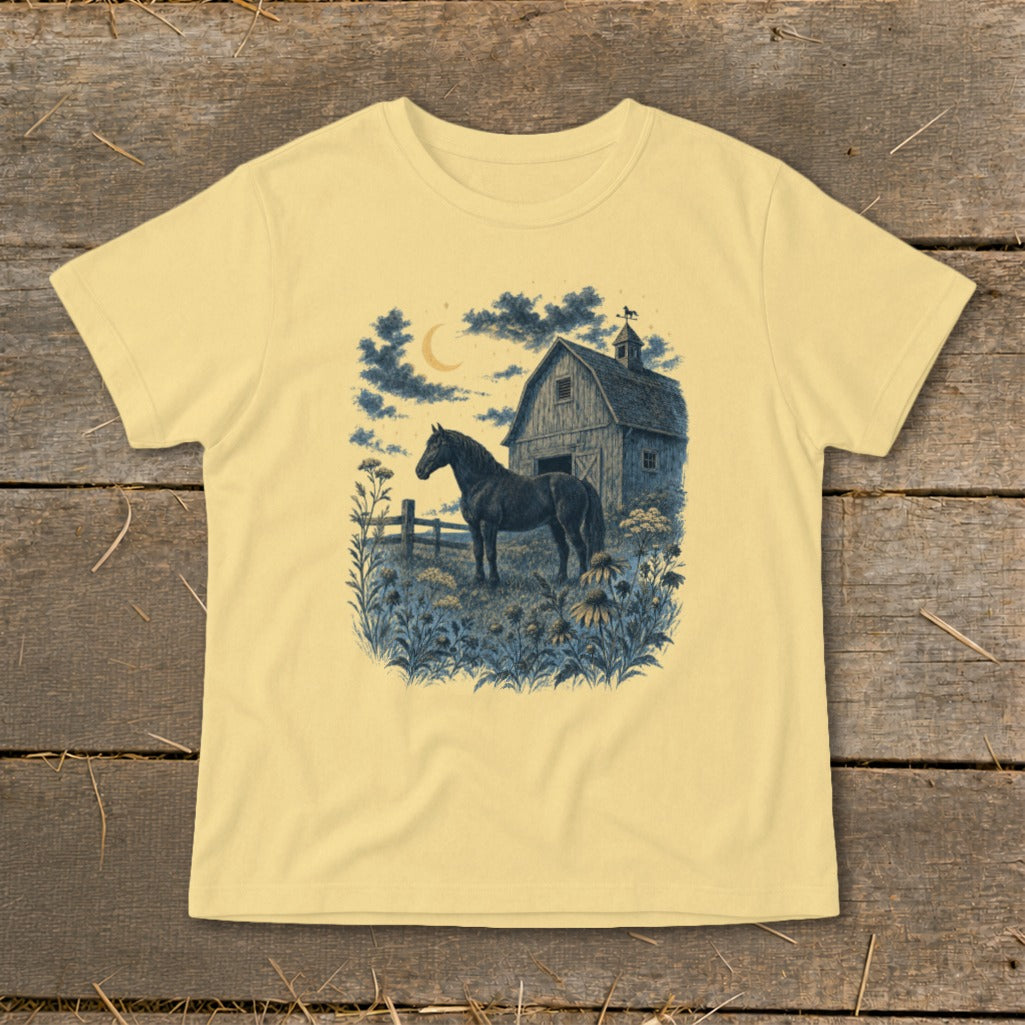 Horse and barn illustration with crescent moon and wildflowers on a light yellow t-shirt.