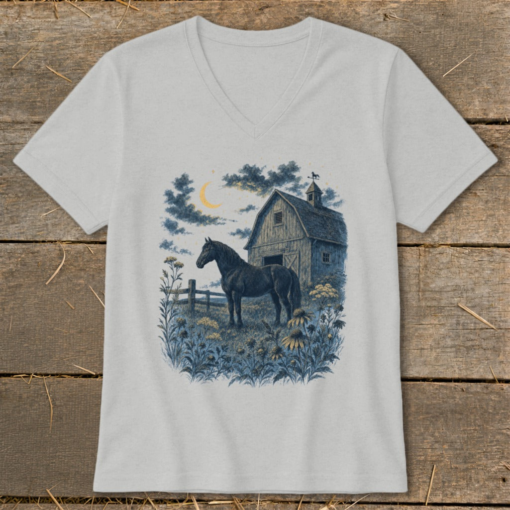 Black horse in field by barn under crescent moon and cloudy sky.