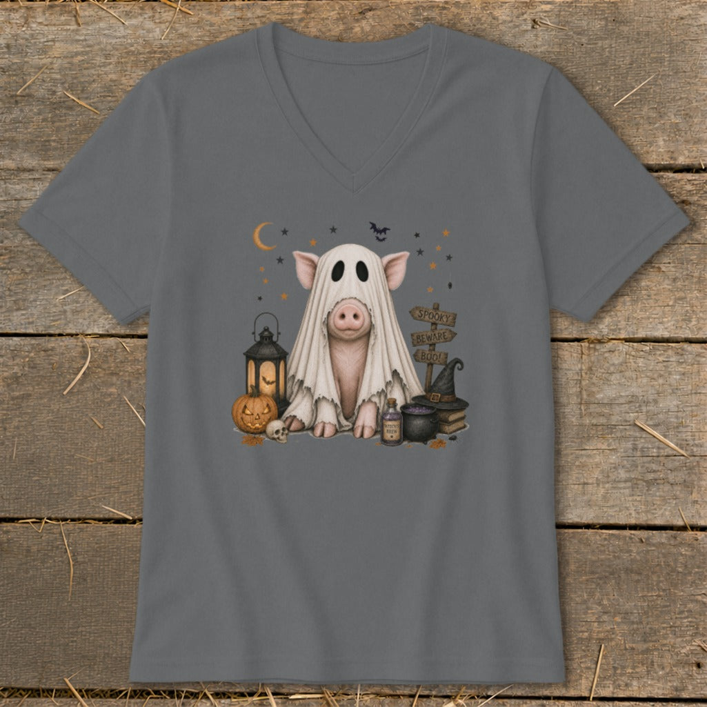 Pig dressed as a ghost with Halloween decorations and spooky signs.