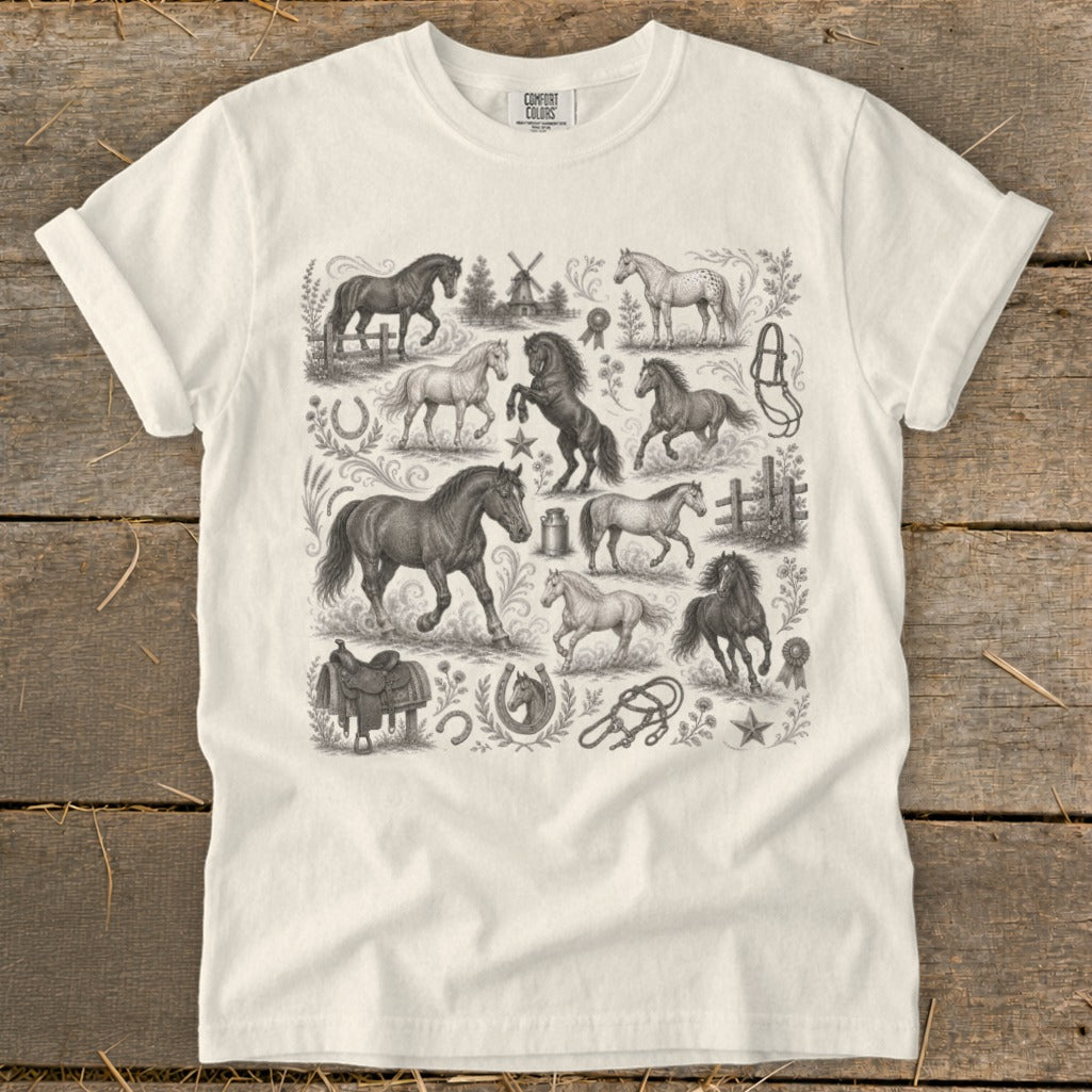 White t-shirt with vintage equestrian illustrations of horses and riding gear.