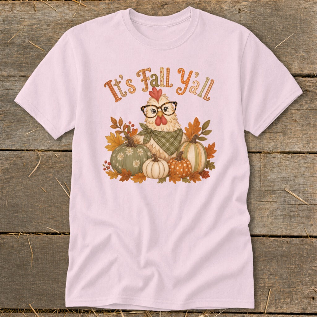 Pink t-shirt with a chicken graphic wearing glasses and a bandana, surrounded by pumpkins and fall leaves.