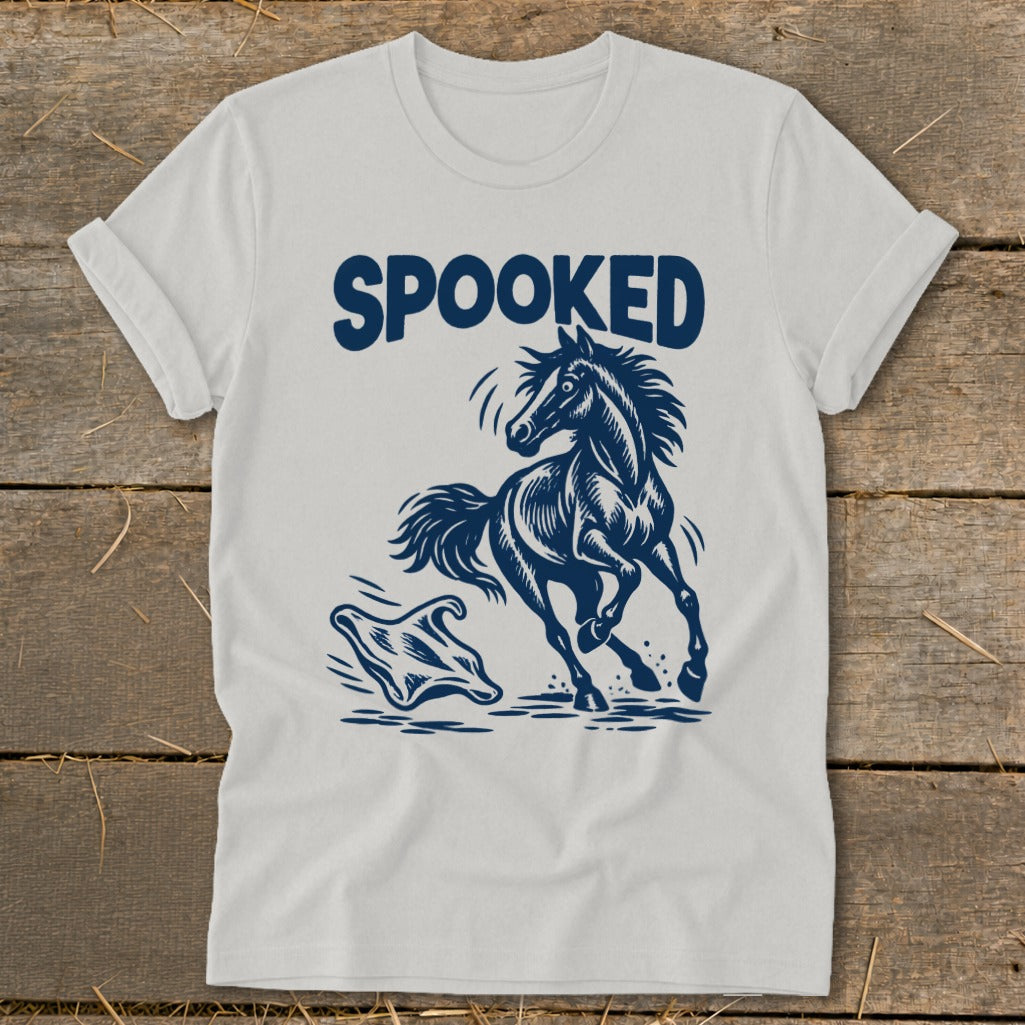 White t-shirt with navy graphic of a horse being spooked by a ghost.
