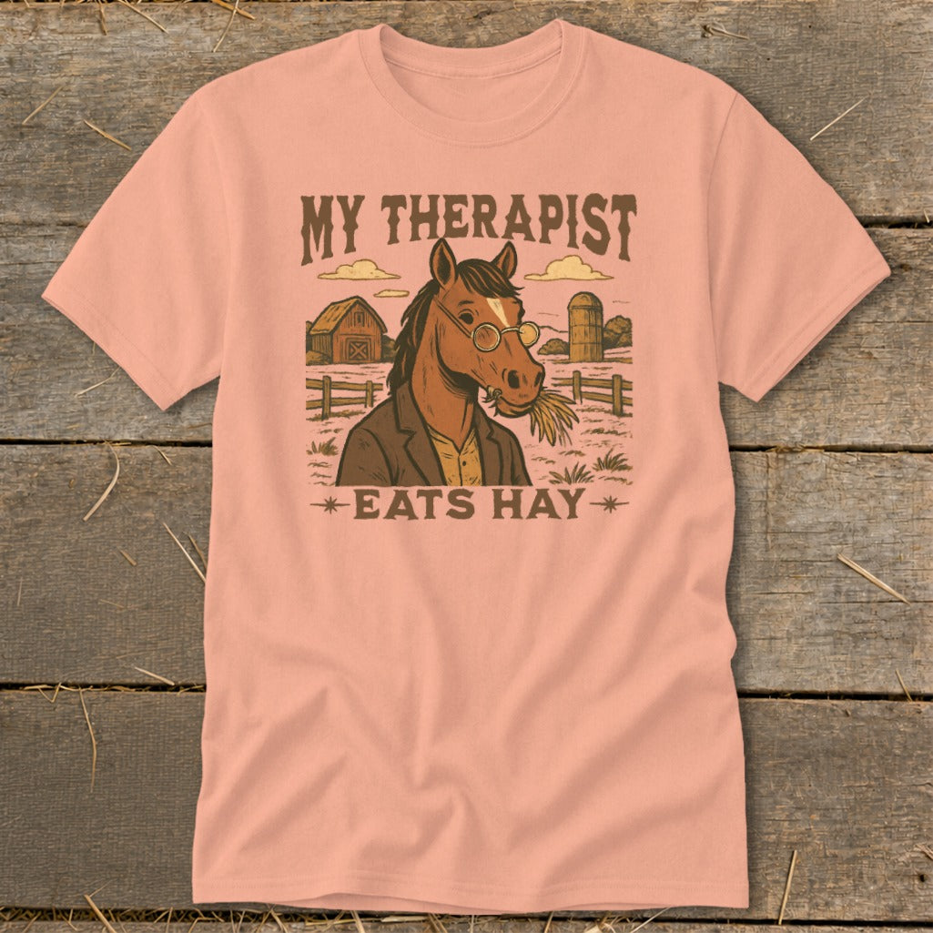 Horse wearing glasses and suit, eating hay, with barn and silo, text reads "MY THERAPIST EATS HAY".