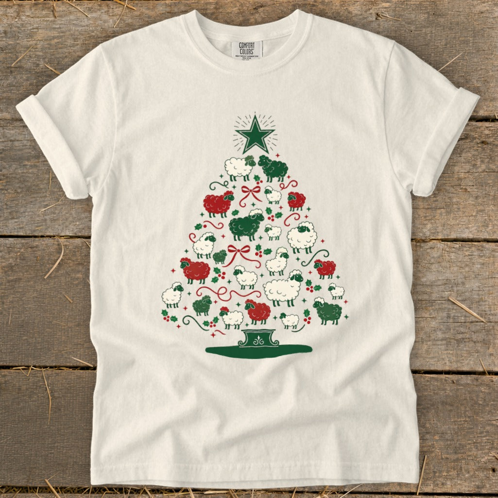 White t-shirt with a Christmas tree made of red and green sheep and holly.