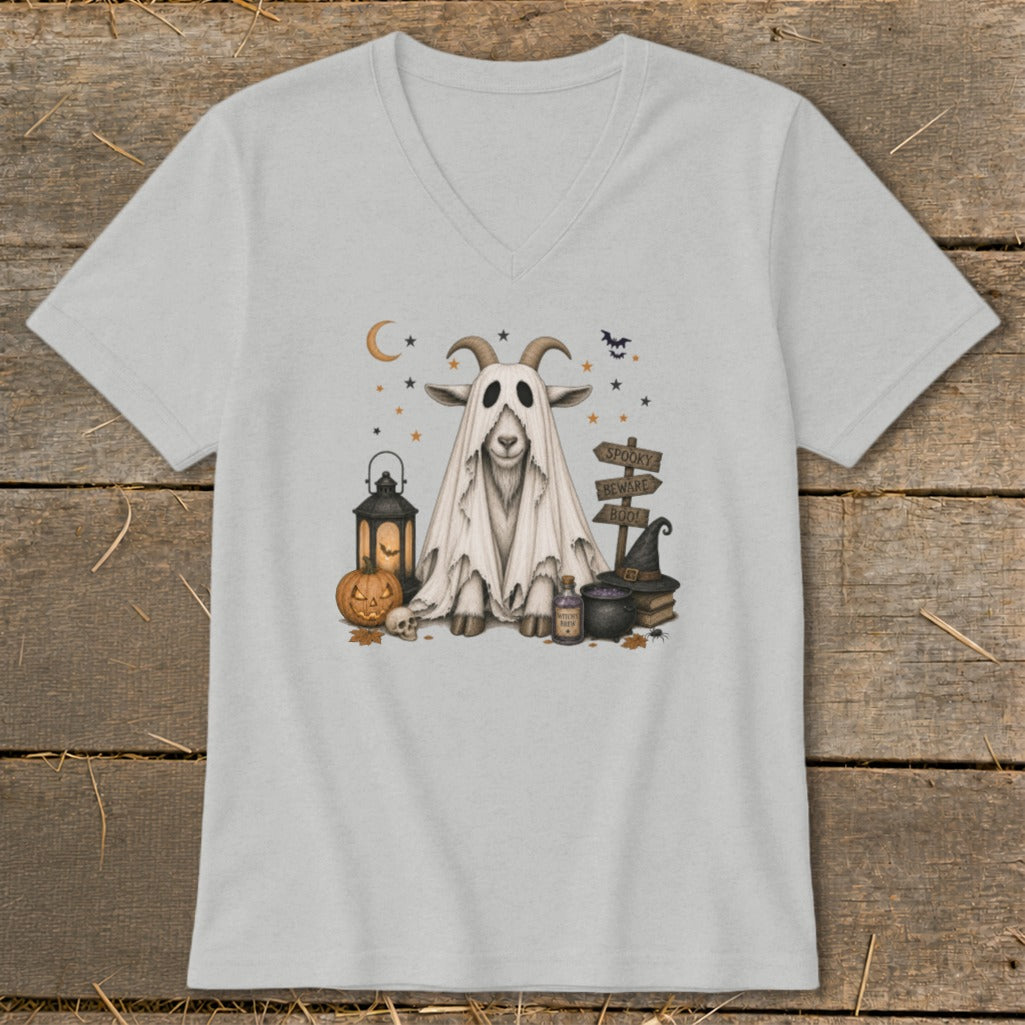 Goat in a ghost costume with Halloween decorations and signs.