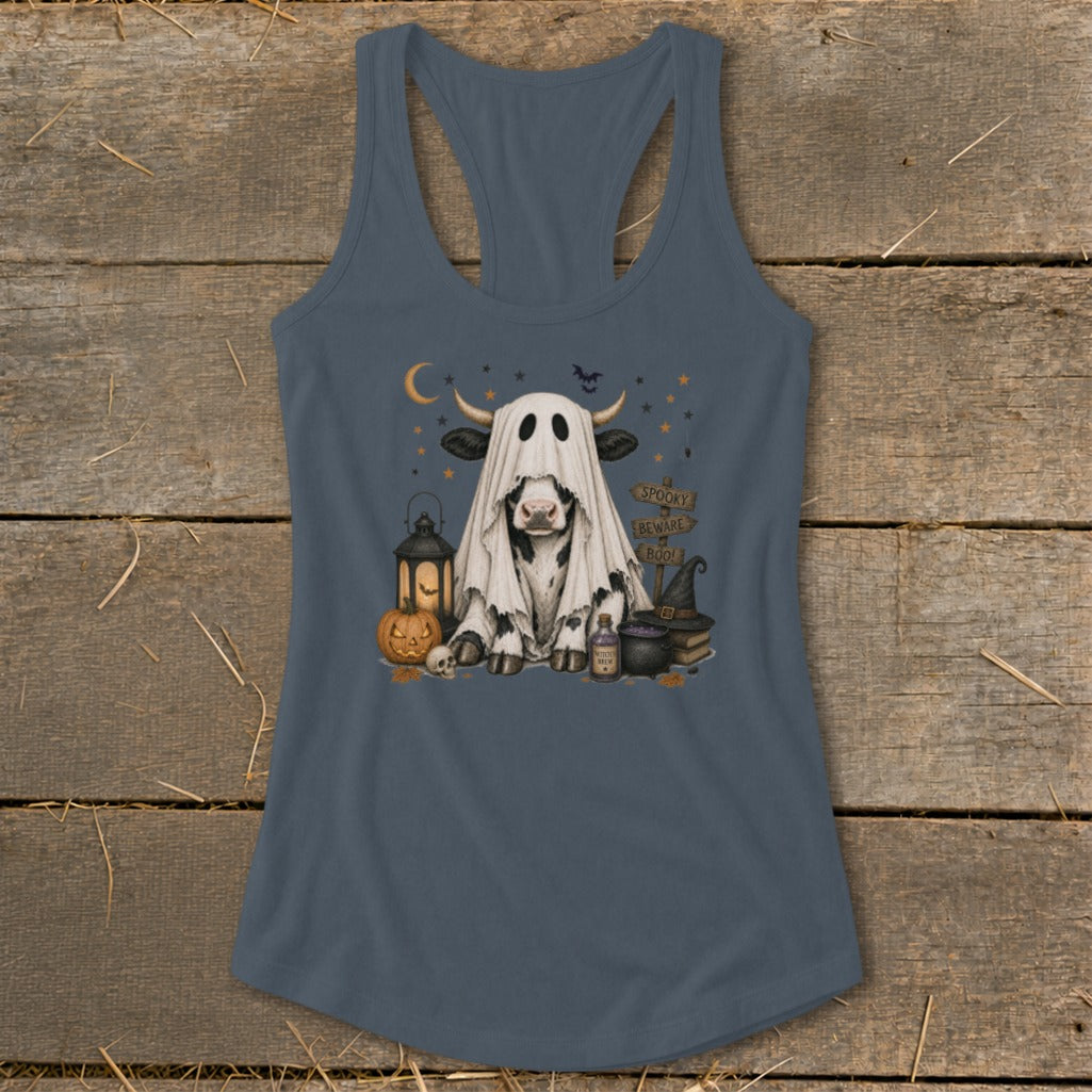 Cow dressed as a ghost with Halloween decorations and spooky signs.